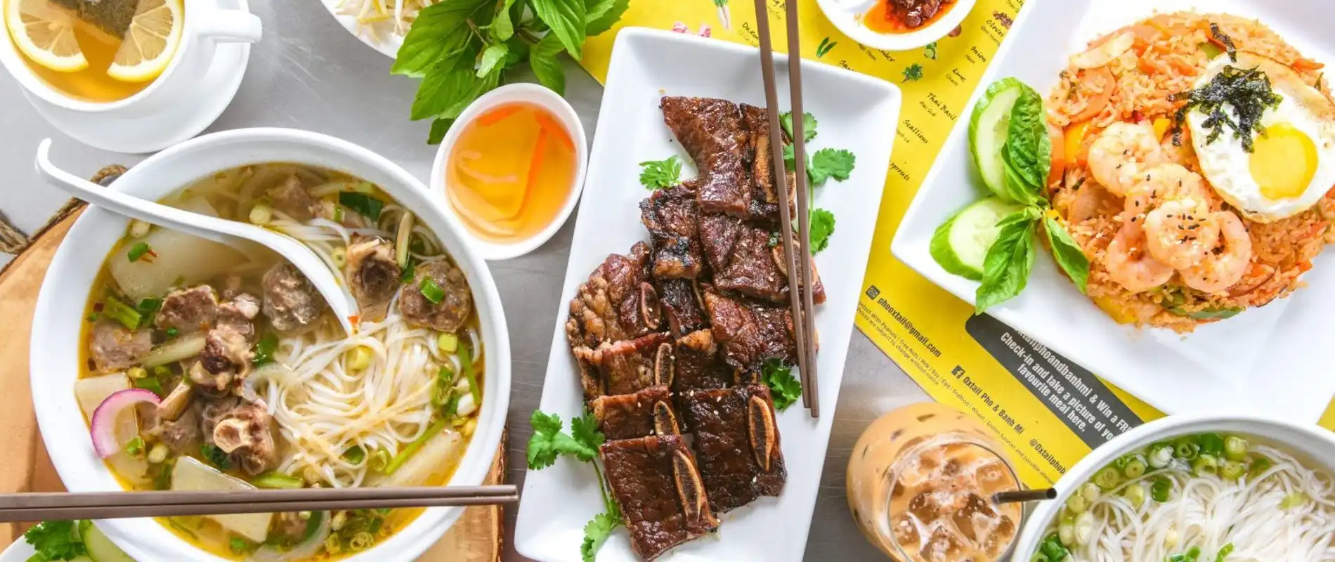 Display of pho and meat dishes