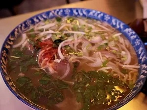 Pho with red meat and veggies
