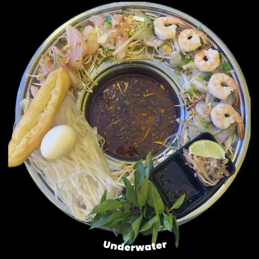 A plate of fish with pho in the middle