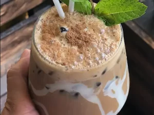 Coffee in glass with mint leaves