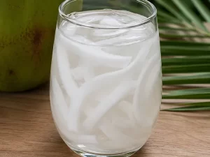 Coconut juice in a clear glass with ice